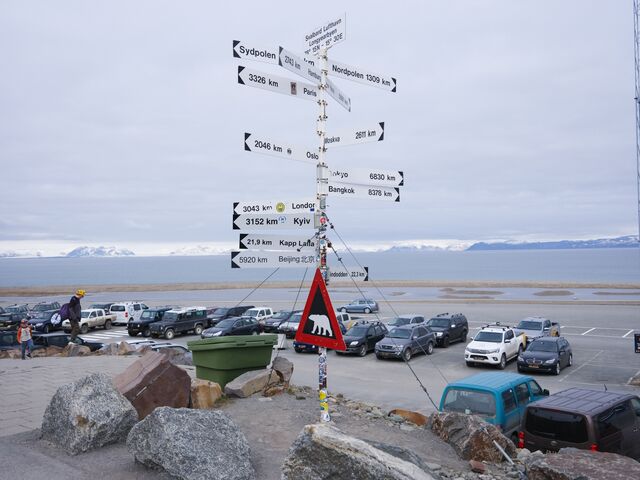 A signpost showing the distance to global cities at the airport in Longyearbyen. Svalbard’s status as a High Arctic hub makes it the northern outpost of choice, placing it on the frontline of today’s international tensions.