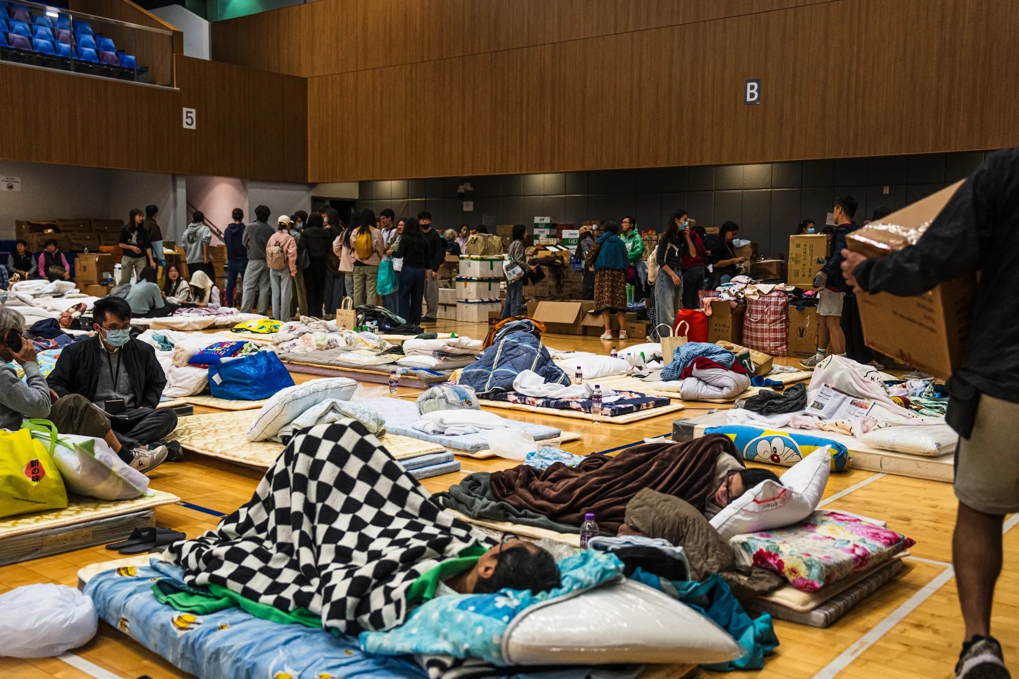 Residents at a temporary shelter near Wang Fuk Court.