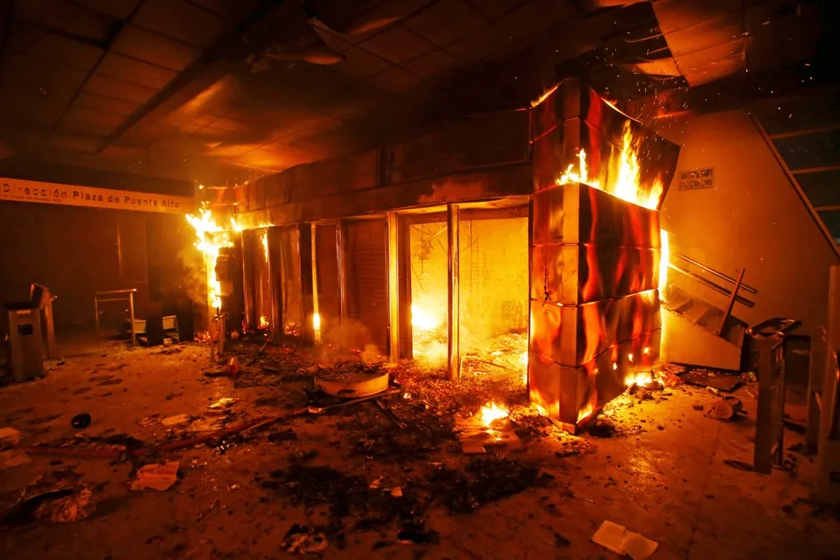 A subway ticket office on fire during a protest October 19 in Santiago.