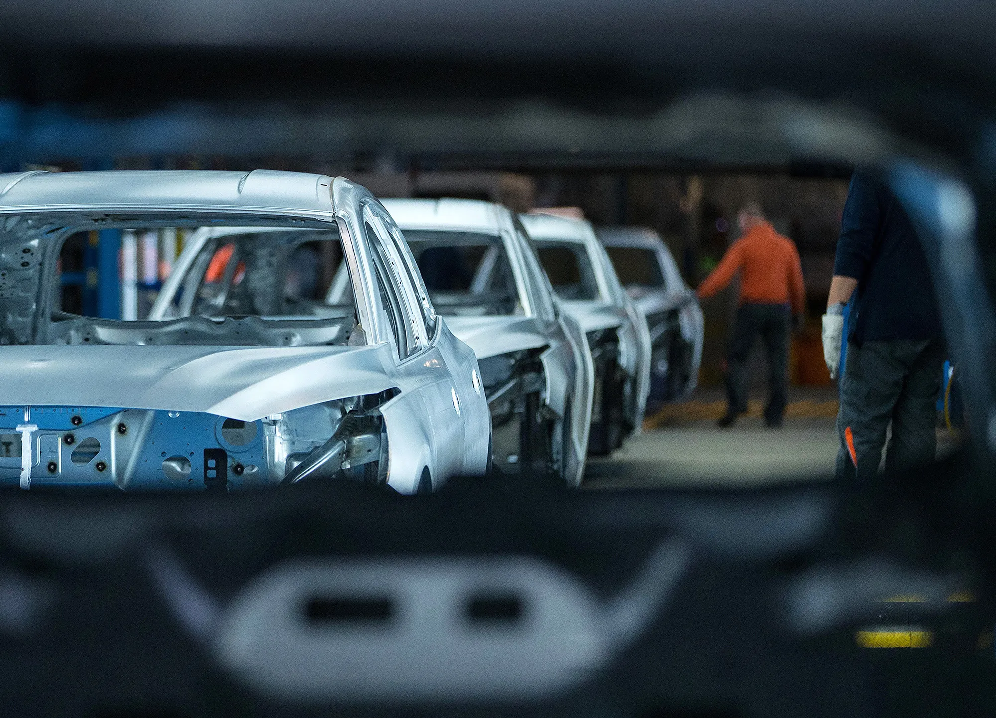 Unpainted automobiles on a quality check line at the Ford Motor factory in Saarlouis, Germany.
