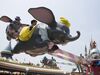 Visitors ride on the Dumbo The Flying Elephant ride at Tokyo Disneyland.