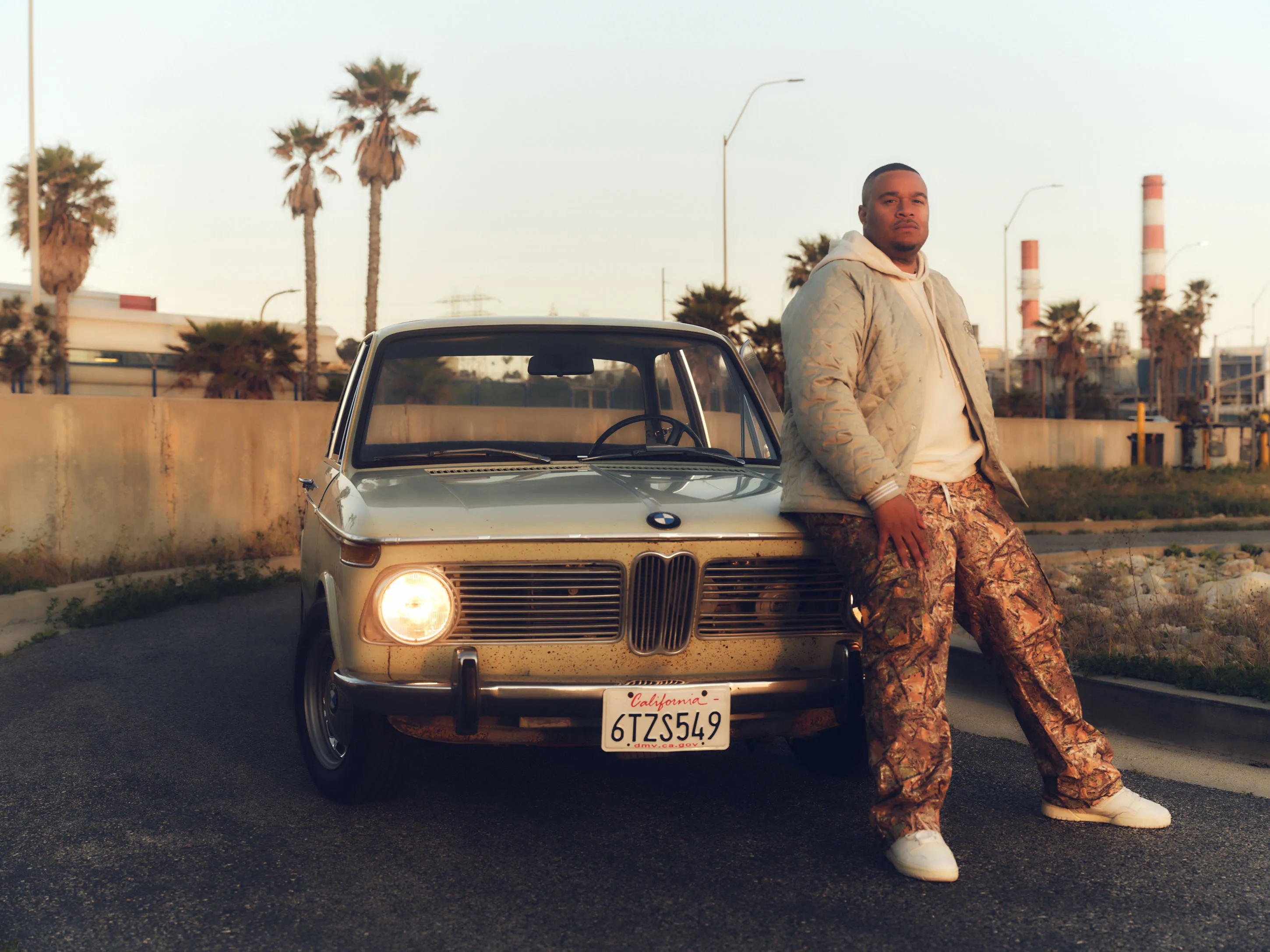 Rashod Bacon and his BMW 1600 in Venice, California.