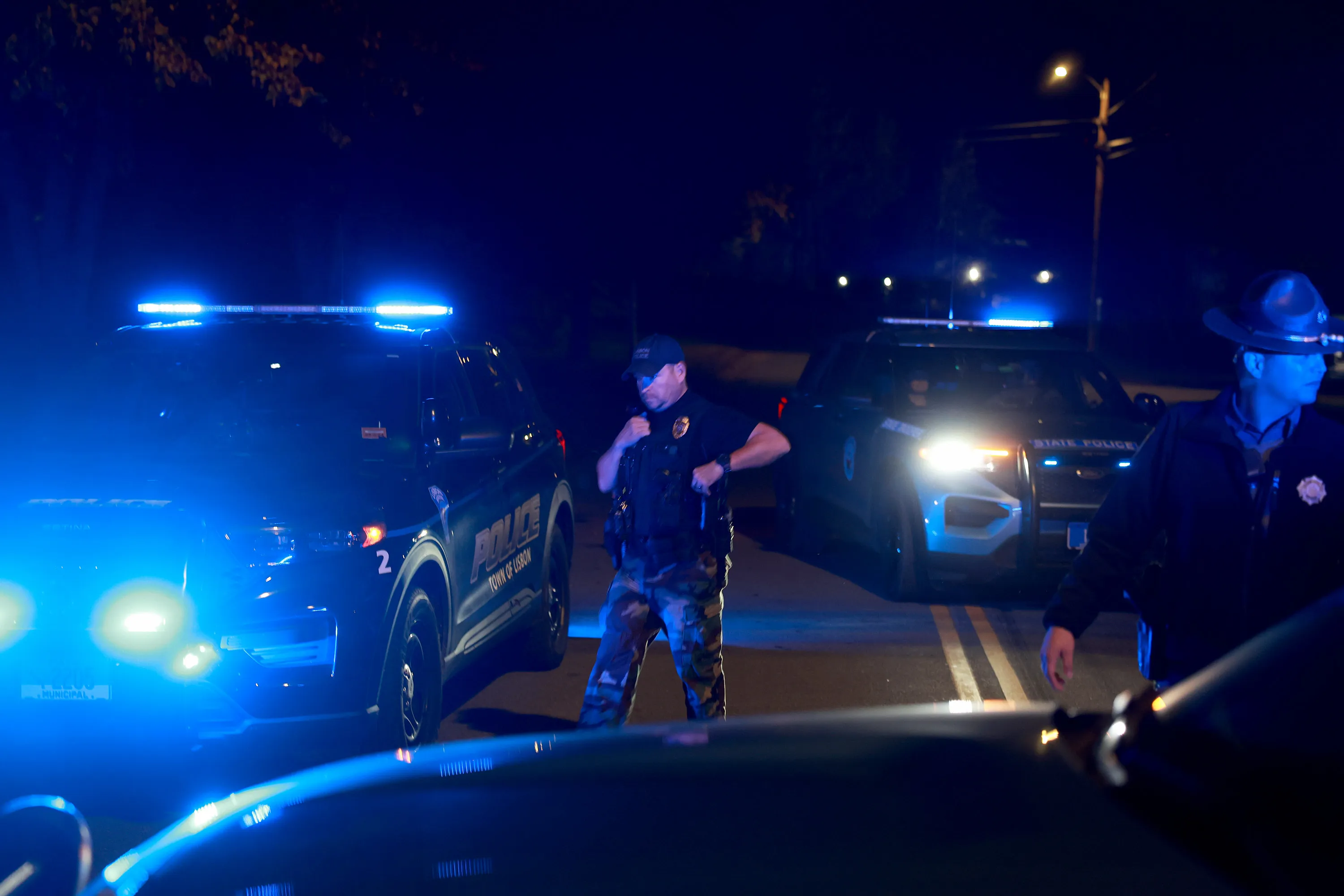Law Enforcement members near the area where Robert Card was found dead.