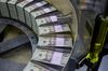 Packs of freshly printed 20 USD notes are processed for bundling and packaging at the US Treasury's Bureau of Engraving and Printing in Washington, DC July 20, 2018. - The dollar slid against the euro and pound on Friday, July 20, 2018, as US President Donald Trump adopted an aggressive posture on trade and foreign exchange, stoking talk of a currency war in addition to a trade war. (Photo by Eva HAMBACH / AFP) (Photo credit should read EVA HAMBACH/AFP/Getty Images)