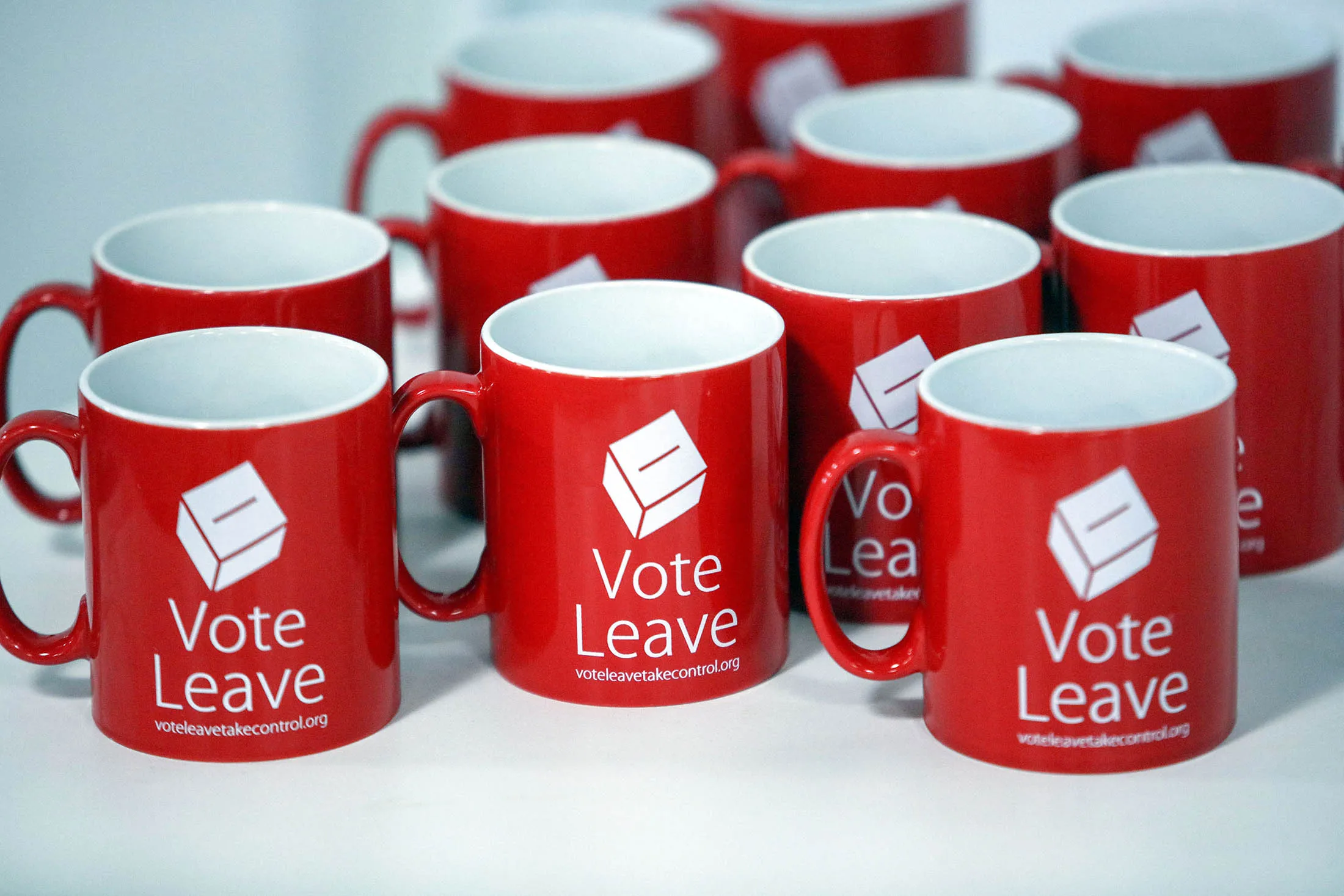 Vote Leave branded mugs sit on a table during a speech at the campaign offices in London, U.K., on Tuesday, April 19, 2016. U.K. Justice Secretary Michael Gove attacked Prime Minister David Cameron's case for Britain staying in the European Union, demonstrating the depth of divisions in the governing Conservative Party.
