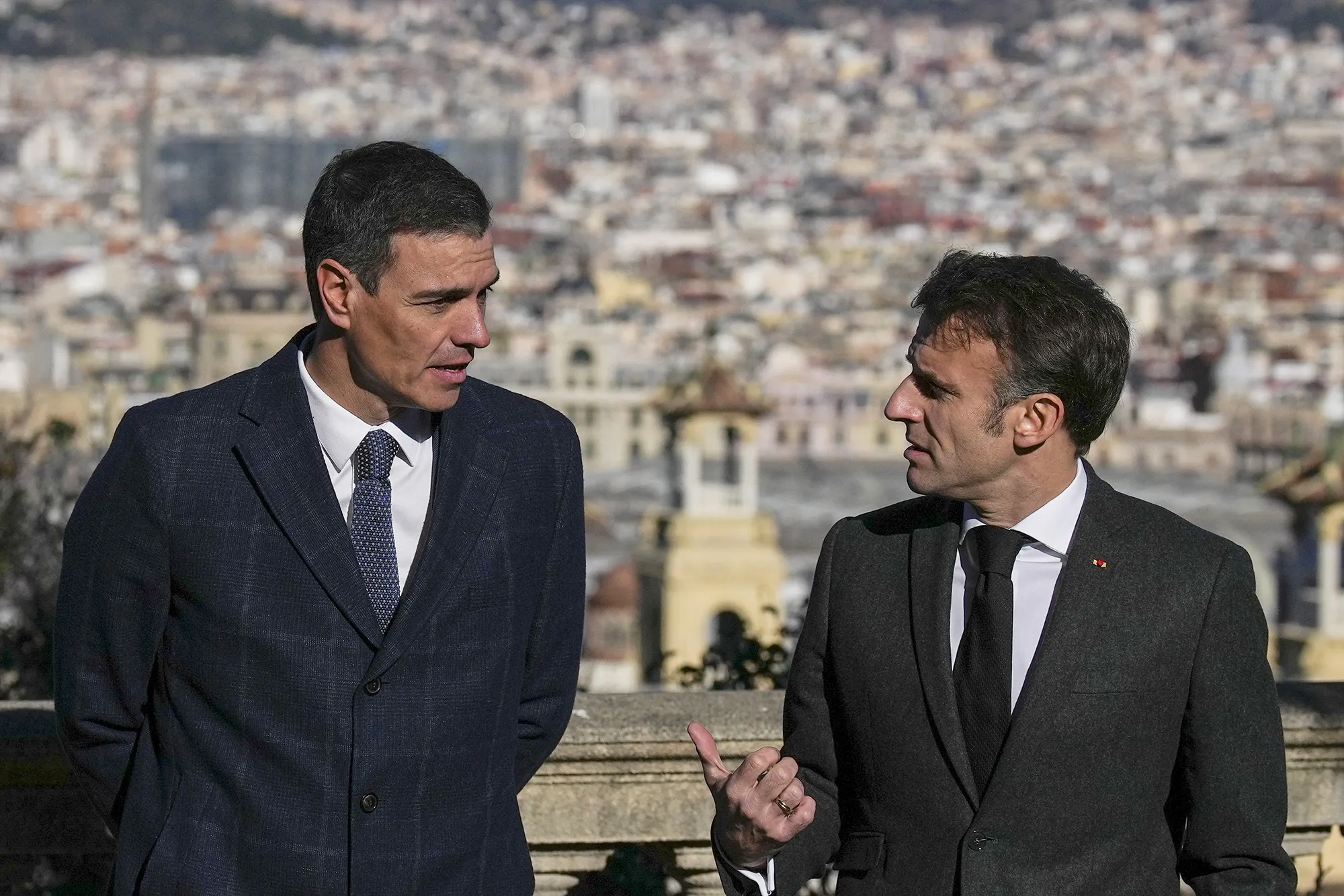 Emmanuel Macron, right, talks with Pedro Sánchez in Barcelona, on Jan. 19