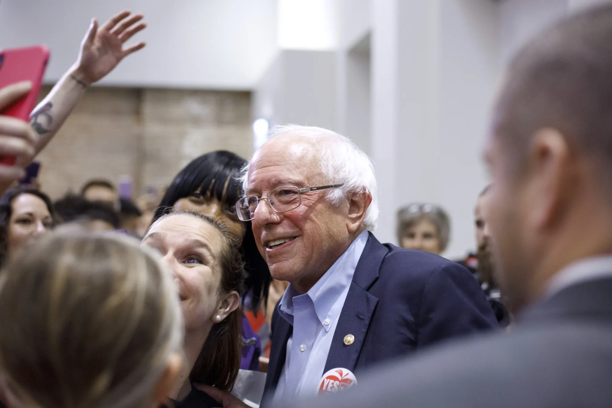 Bernie Sanders stands for a photograph with an attendee during a rally in Chicago on Sept. 24.
