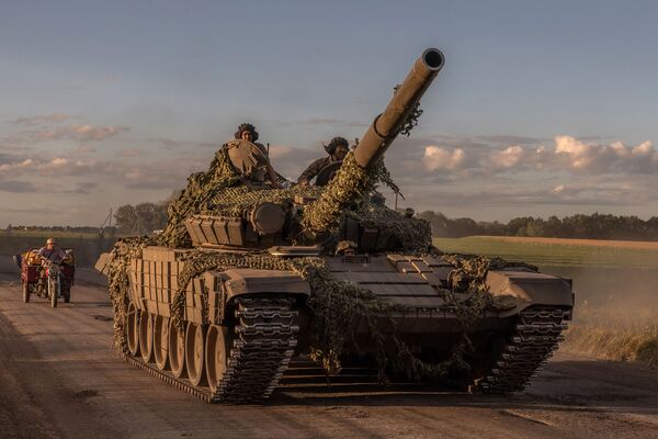 Ukrainian servicemen drive a tank near the Kursk region border, on Aug. 12.