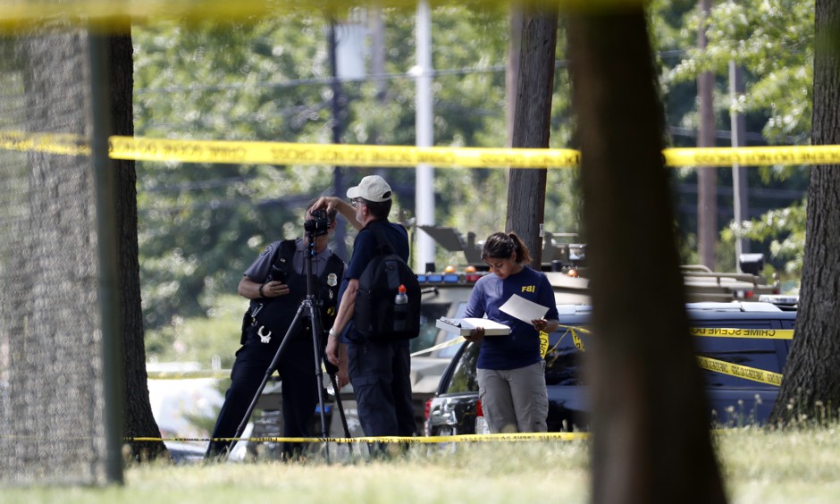 FBI investigators work the scene of a shooting near at a baseball field in Alexandria, Virginia, where House Majority Whip Steve Scalise and others were shot.