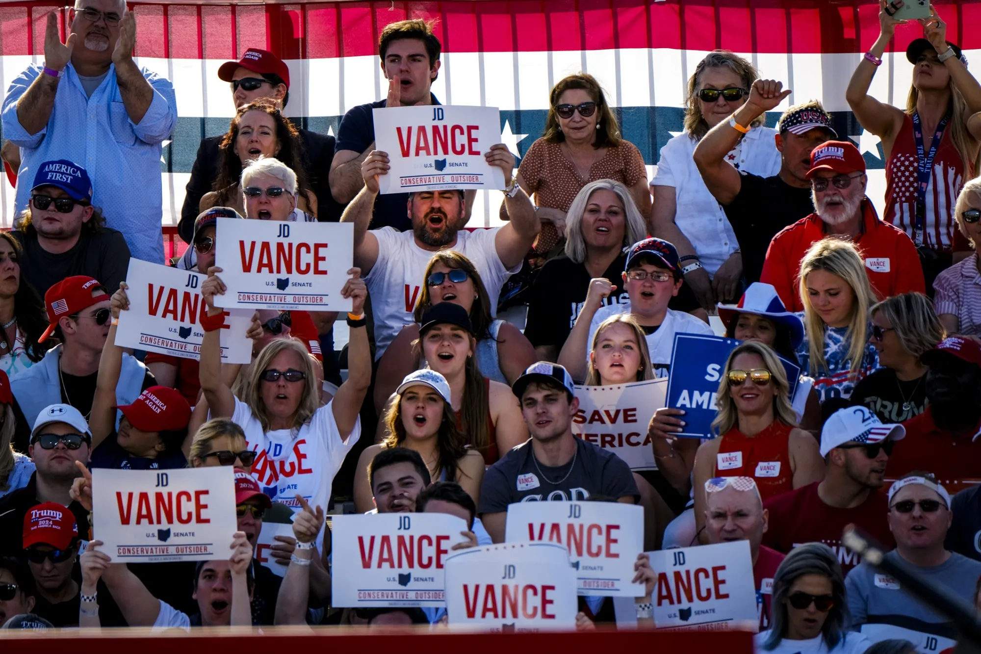 Attendees cheer on JD Vance during a ‘Save America’ rally in Delaware, Ohio.