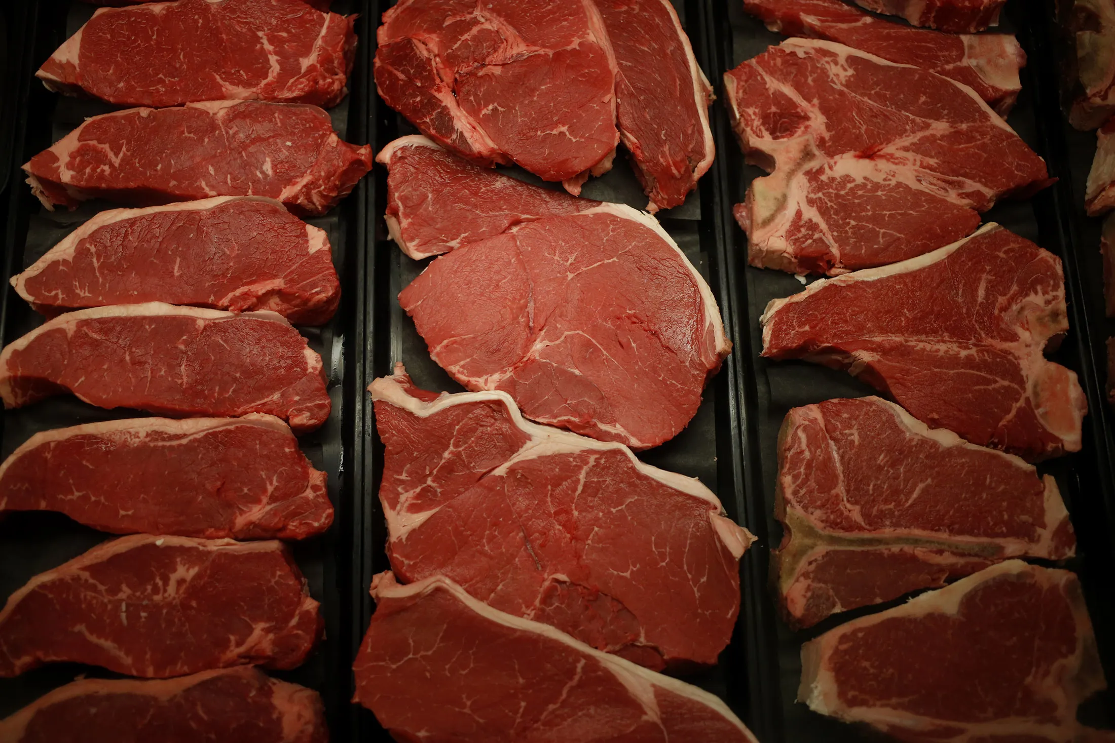 Beef sirloin steaks are displayed behind the meat counter a grocery store in Knoxville, Tennessee, U.S.
