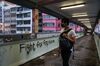 A man walks on an overpass bridge in the Sai Wan Ho district on Nov. 12.