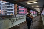 A man walks on an overpass bridge in the Sai Wan Ho district on Nov. 12.