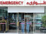 Medical workers exit a Dr. Sulaiman Al Habib Medical Group hospital in Riyadh.