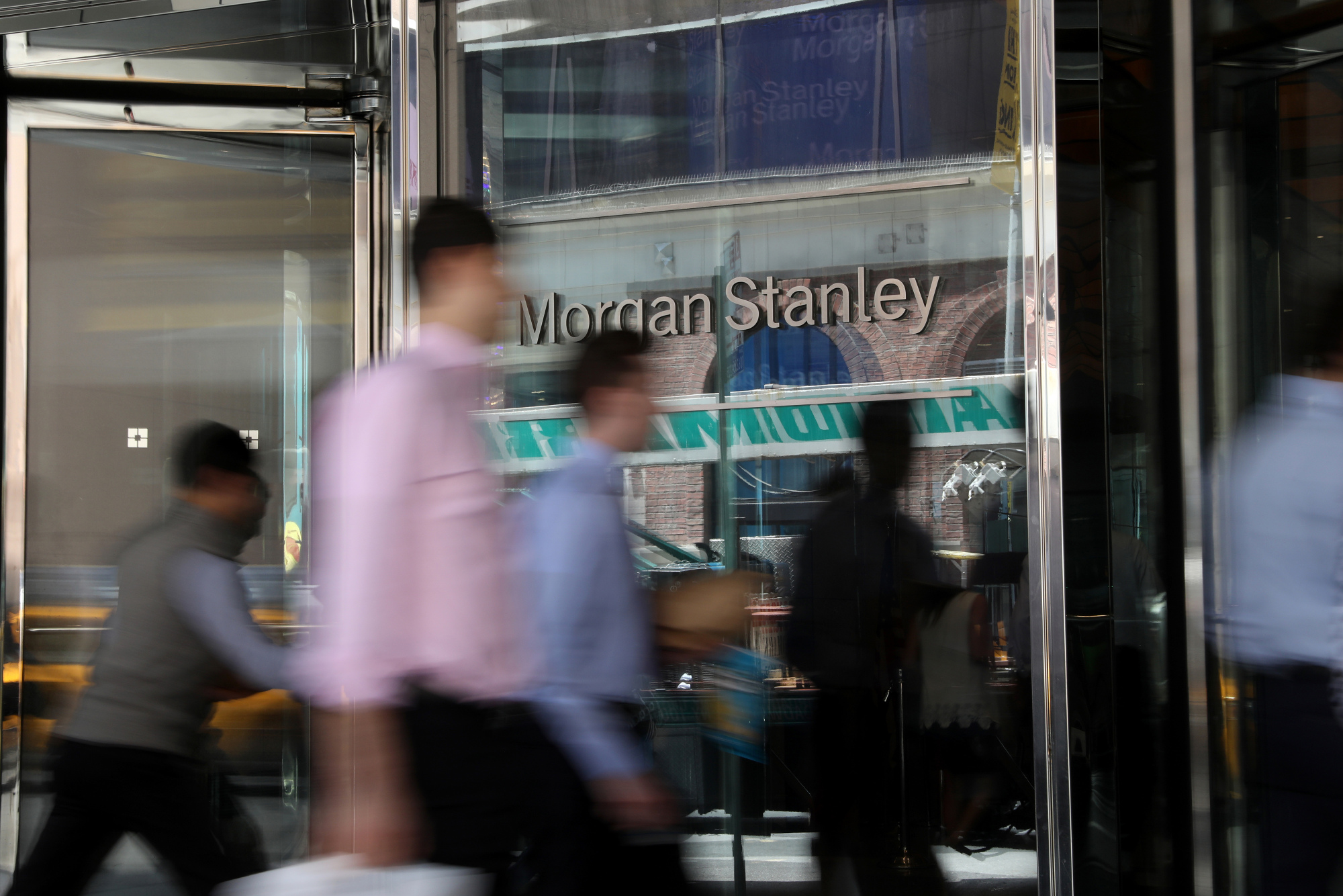 Pedestrians pass in front of Morgan Stanley headquarters in New York.
