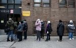 People wait in line for Covid-19 vaccines at Corsi Houses in Harlem, New York on Jan.&nbsp;15.
