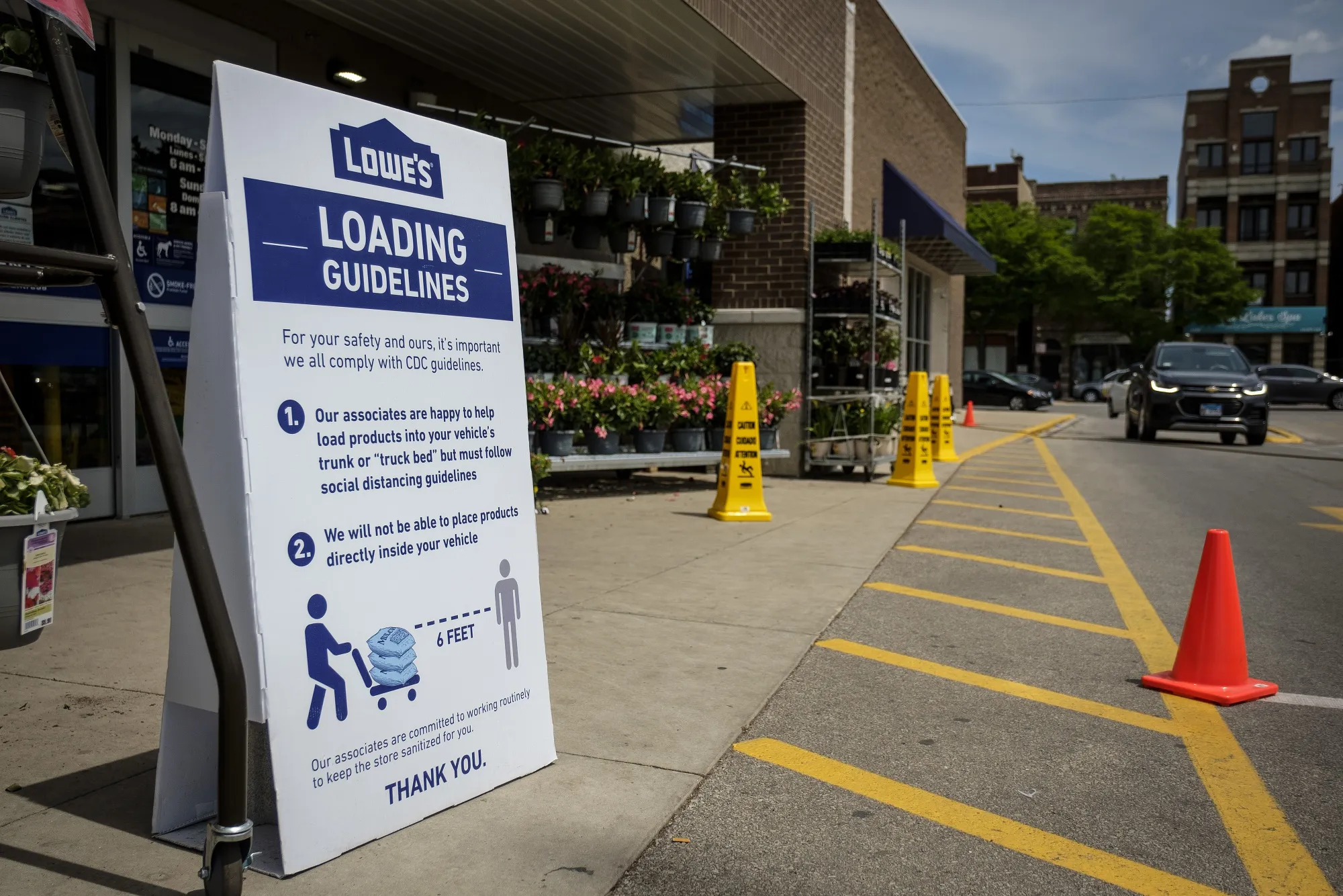 A "Loading Guidelines" sign is displayed outside a Lowe's Cos. Inc. store in Chicago, Illinois, U.S., on Thursday, May 7, 2020. Governor Pritzker extended the state's stay-at-home order through the end of May, but he loosened restrictions on certain outdoor activities starting May 1.