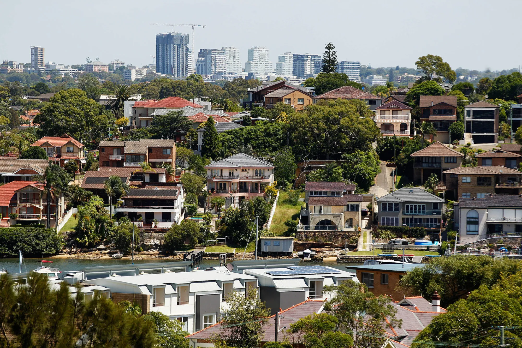 Houses stand in Sydney, Australia, on Wednesday, Feb. 17, 2016. Australia's opposition Labor Party is proposing scaling back tax breaks for landlords that have helped fuel a 50 percent increase in property prices in capital cities since 2008.
