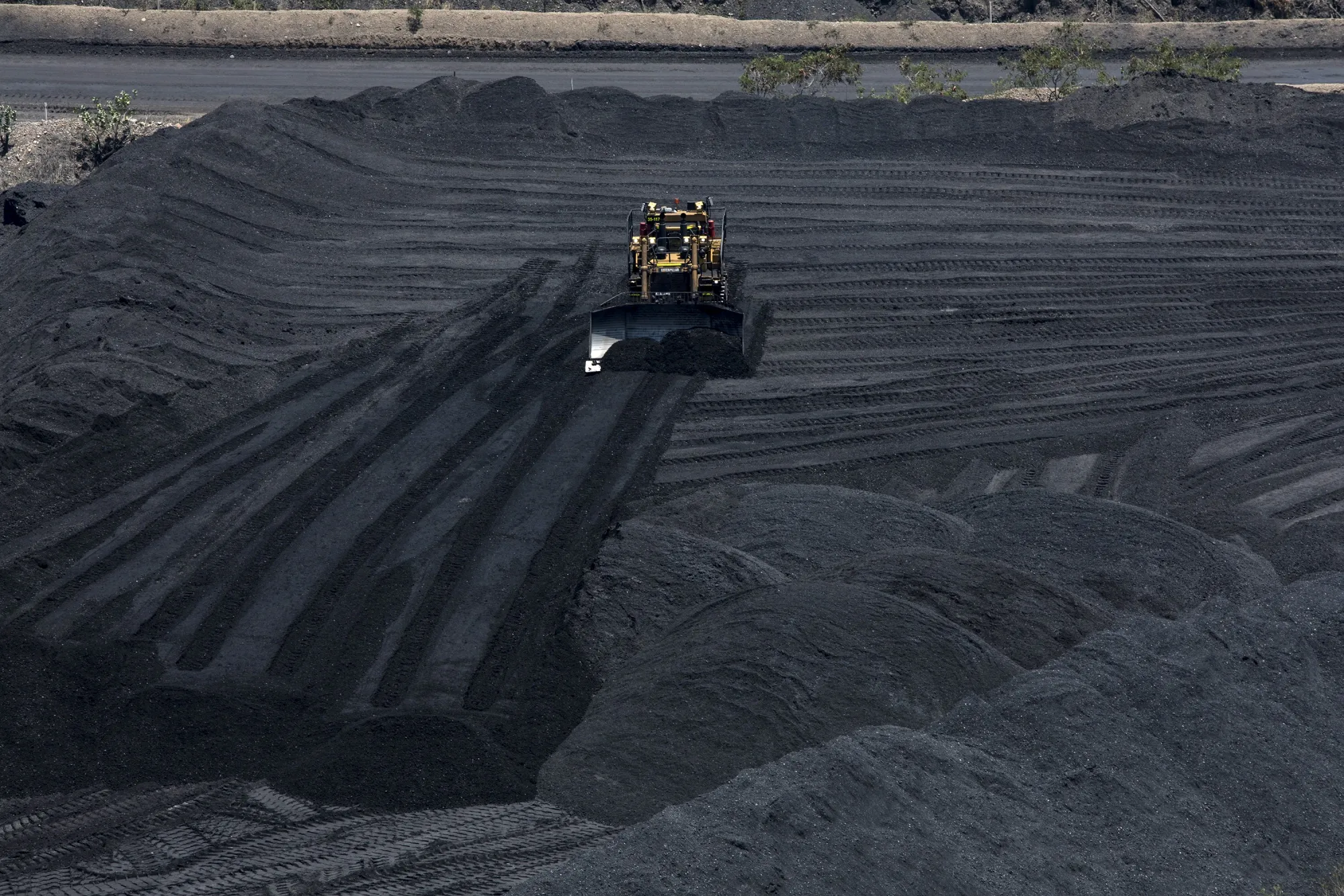A bulldozer moves coal at a coal mine in Colombia.