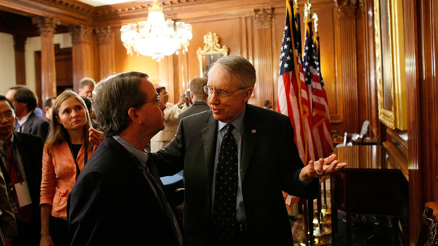Then-Senate Majority Leader Harry Reid confers with spokesman Jim Manley at the U.S. Capitol on Sept. 28, 2007.
