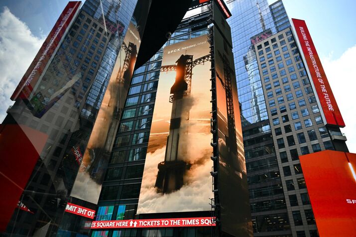 Images of SpaceX on screens in Times Square on June 12.