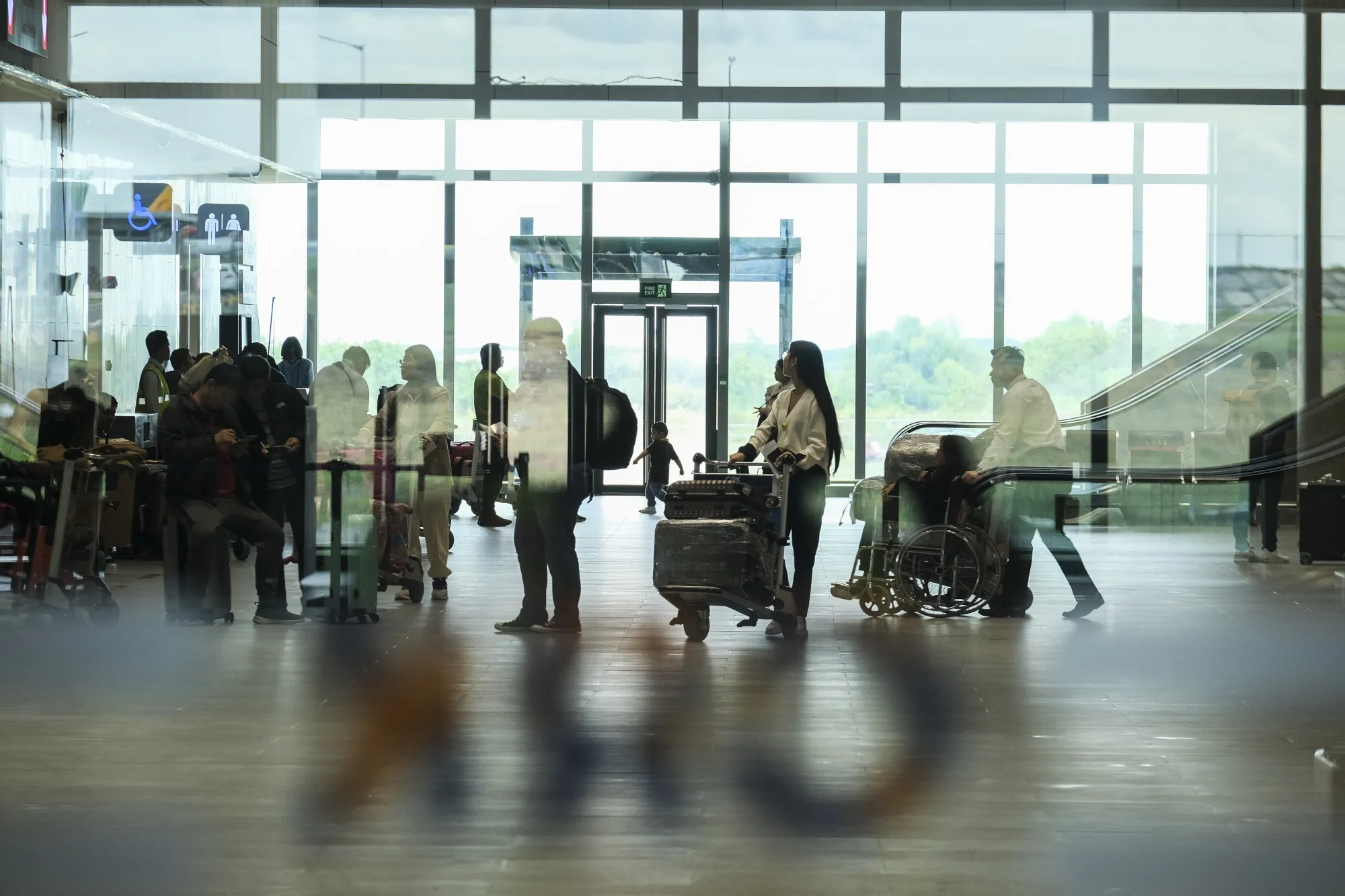 Travelers arrive at Clark International Airport, in Pampanga province, the Philippines.