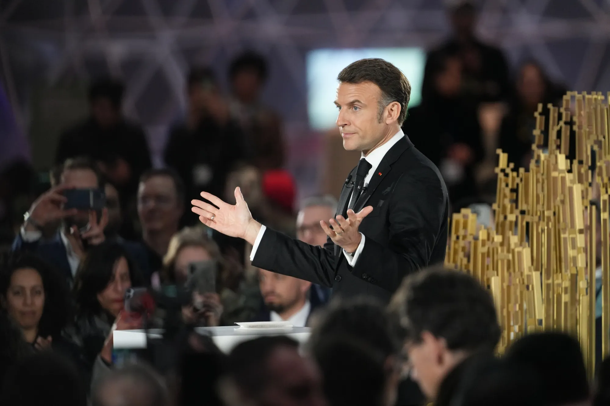 Emmanuel Macron delivers a speech during a closing event for the first day of the Artificial Intelligence (AI) Action Summit at the Grand Palais in Paris, on Feb. 10.
