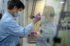 A lab technician processes RT-PCR Covid-19 tests at Prenetics Ltd.'s laboratory in Hong Kong, China on Friday, July 31, 2020. Prenetics, along with other Hong Kong labs and hospitals, has been overloaded with people seeking virus tests since the new wave emerged 18 days ago, Chief Executive Officer Danny Yeung said in an interview last month.