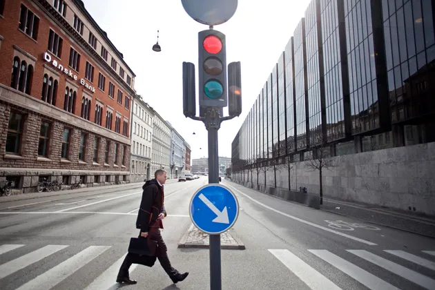 The headquarters of Danske Bank, left, stand opposite the Danish central bank in Copenhagen