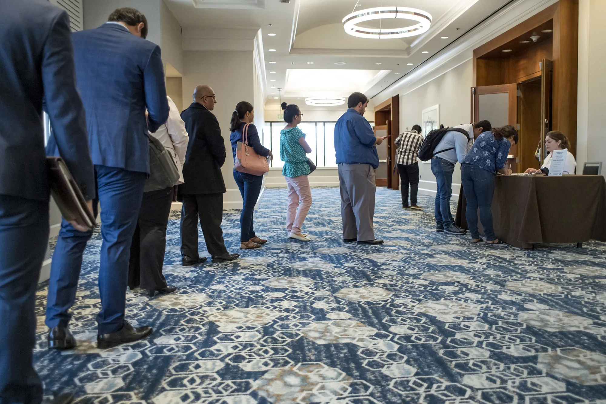 Job seekers wait in line to registered during a Coast-to-Coast career fair in San Jose, California, U.S., on Wednesday, July 19, 2017. The U.S. Department of Labor will release jobless claims figures on July 20.