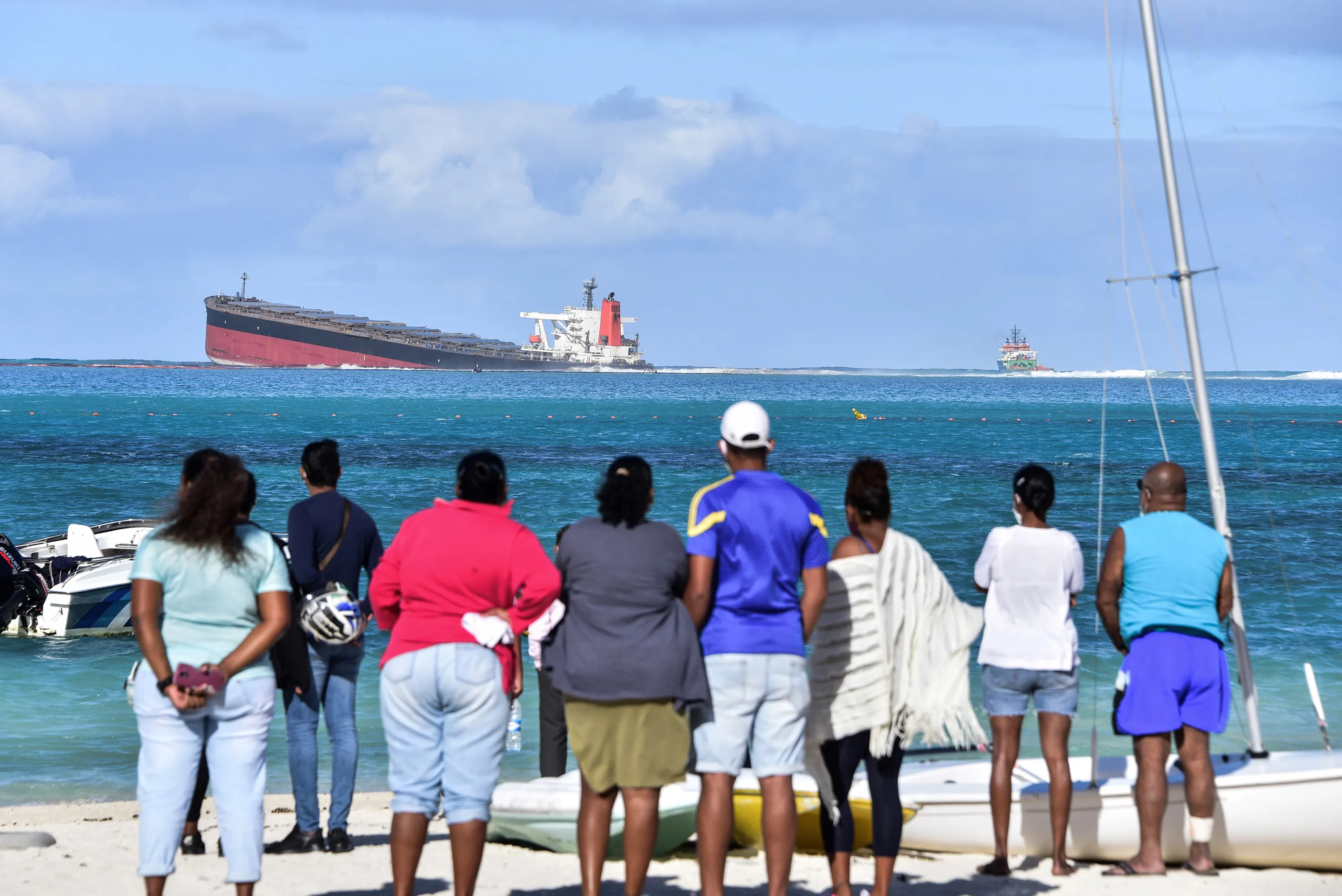 Bystanders look at the MV Wakashio bulk carrier which is leaking oil&nbsp;near Blue Bay Marine Park in&nbsp;Mauritius on Aug. 6