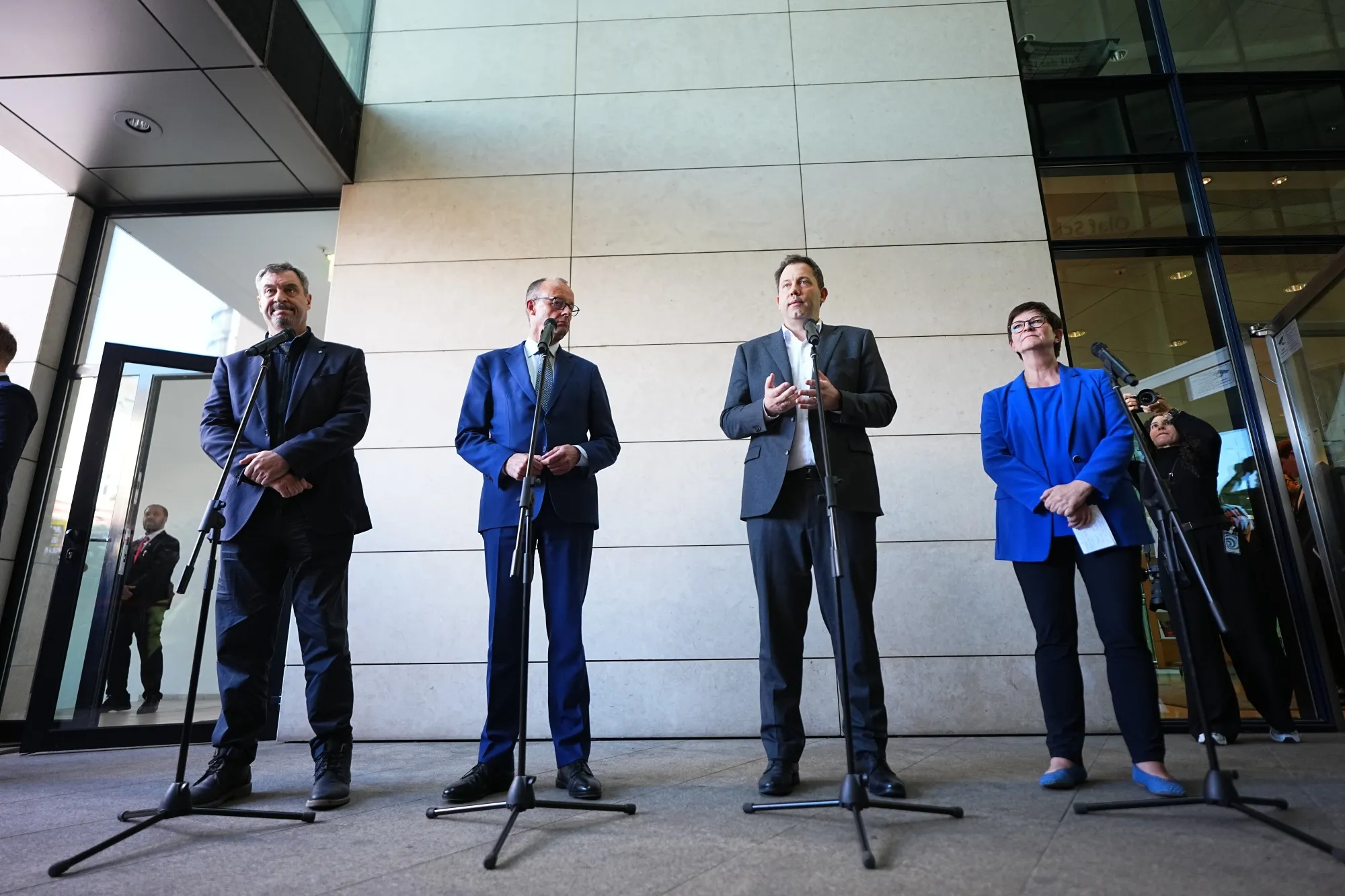 CSU Chairman Markus Soeder, CDU Chairman Friedrich Merz, SPD Co-leader Lars Klingbeil, and SPD Co-leader Saskia Esken, from left, in Berlin on March 28.
