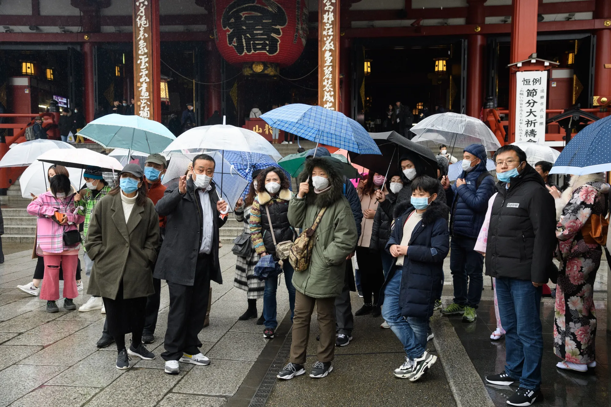 Tourist wearing face masks gather in front of the Sensoji temple in the Asakusa district of Tokyo on&nbsp;Jan. 28.