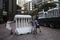 Workers move a barricade ahead of a visit by Zhang Dejiang on Monday. Photographer: Justin Chin/Bloomberg