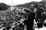 Civil rights leader Dr. Martin Luther King Jr. waves to supporters on the National Mall in Washington, D.C. during the "March on Washington" on August 28, 1963.