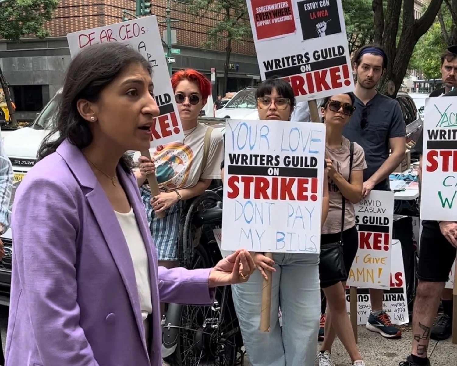 FTC Chair Lina Khan speaks to picket line outside the view studio in New York on July 10.