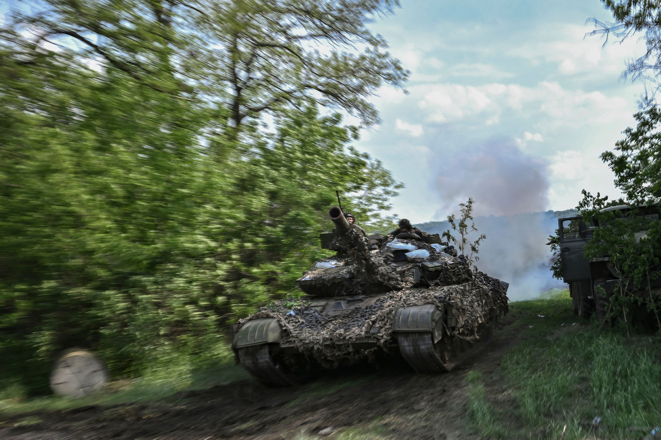 Ukrainian service members operate a tank at a front line position near the city of Lysychansk, eastern Ukraine, on May 20.
