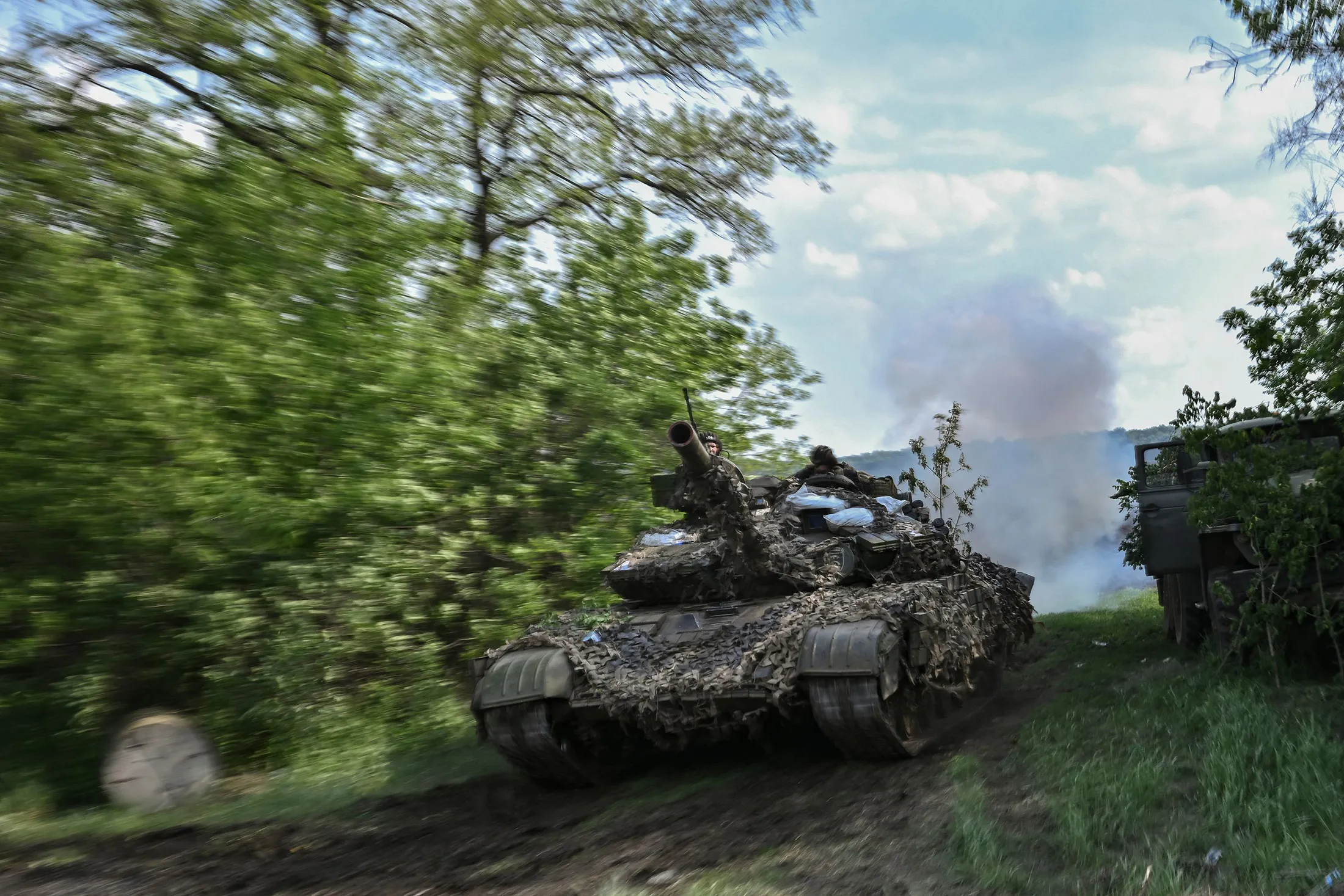 Ukrainian service members operate a tank at a front line position near the city of Lysychansk, eastern Ukraine, on May 20.