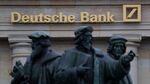The Gutenberg memorial statue stands outside a Deutsche Bank AG bank branch in Frankfurt, Germany.