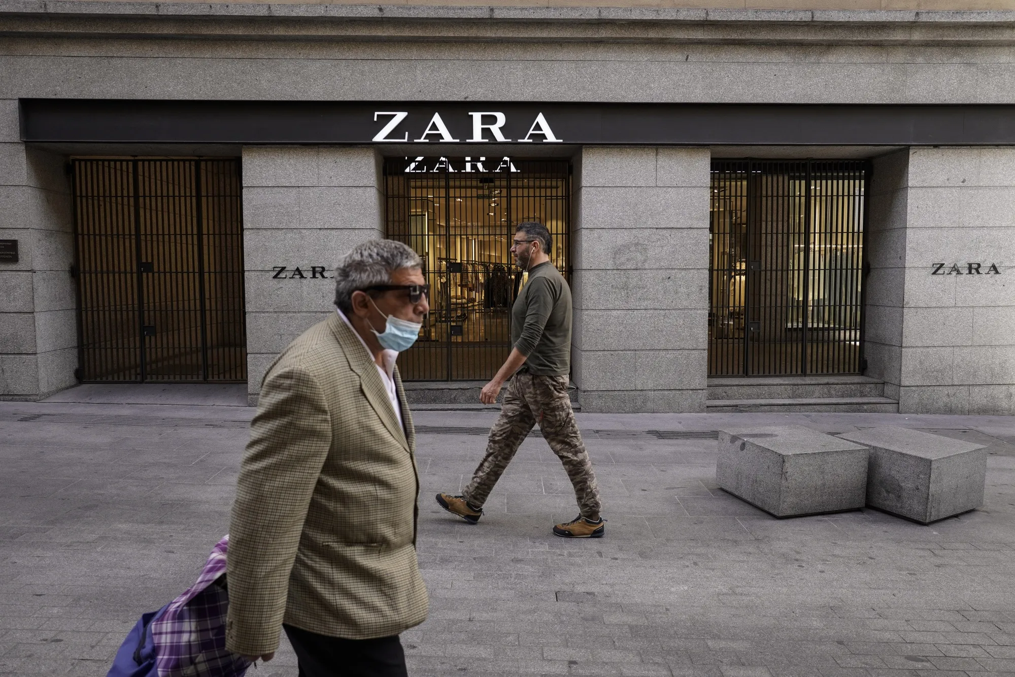 Pedestrians pass by a closed Zara store, operated by Inditex SA, in Madrid, Spain, on Thursday, May 7