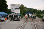 Supporters of miners stand on train tracks in Cumberland, Kentucky on Aug. 2.