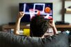 Man watching basketball on tv