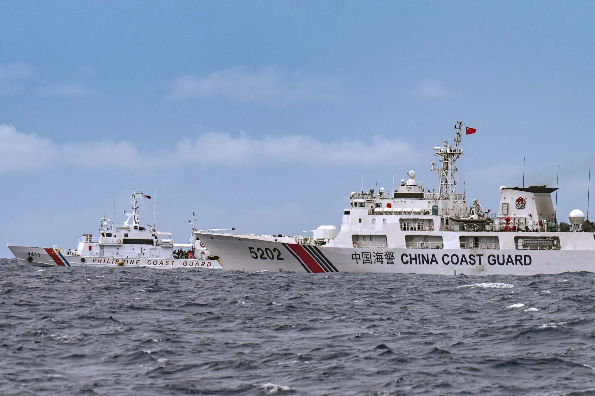 A China Coast Guard ship and Philippine Coast Guard ship,&nbsp;during a supply mission to Sabina Shoal in disputed waters of the South China Sea.