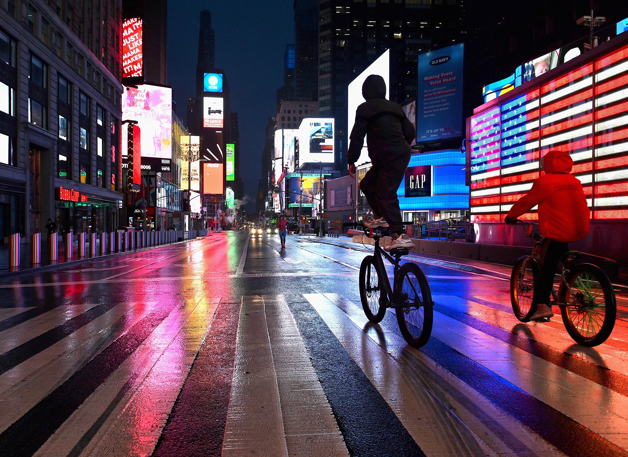 People ride their bikes through Times Square in New York on Oct.&nbsp;12.