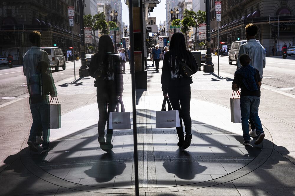 Pedestrians carry shopping bags on Geary street in San Francisco.