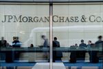People stand inside the lobby of the JPMorgan Chase & Co. headquarters building in New York.