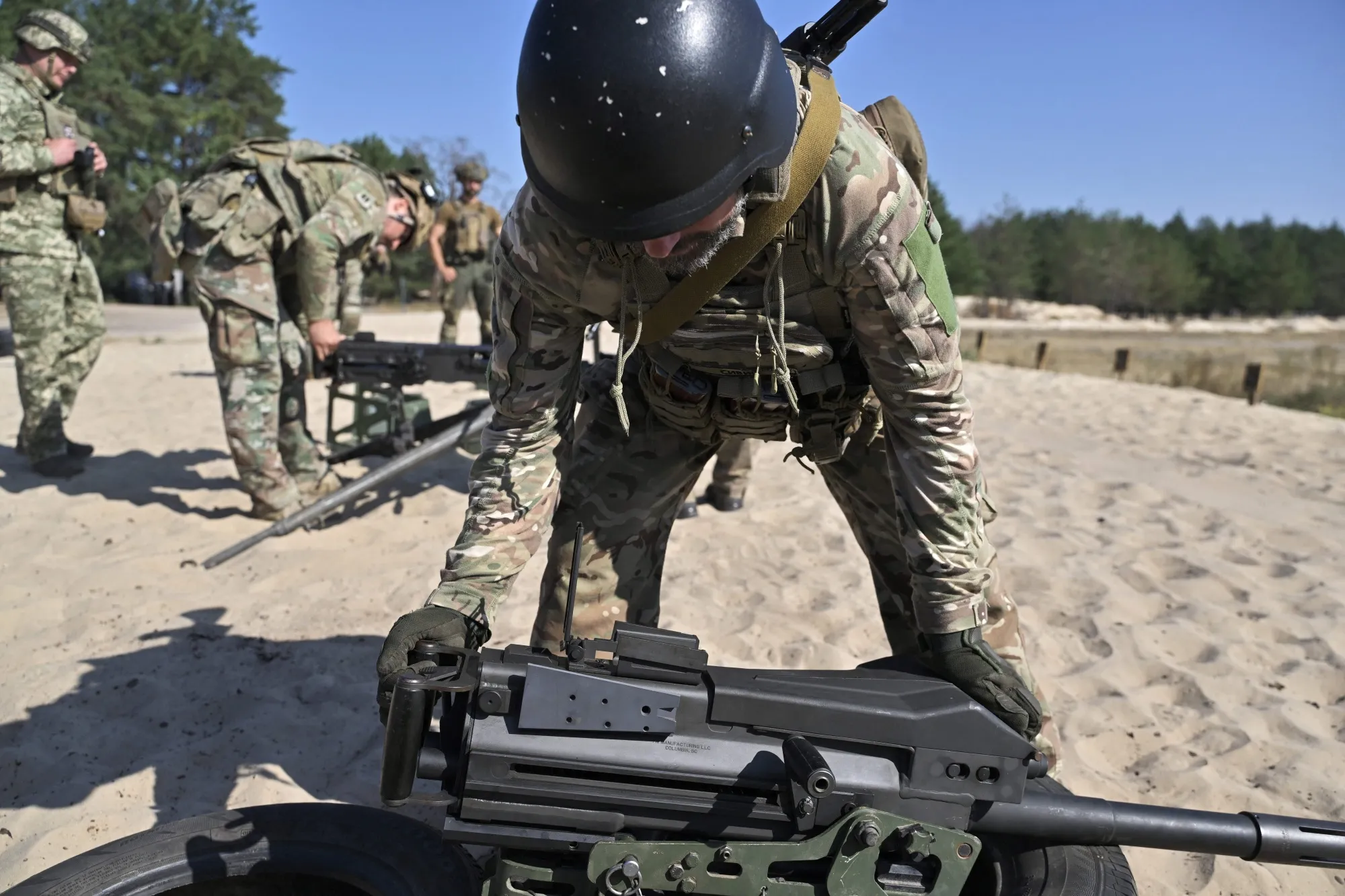 A Ukrainian serviceman holds a US made MK19 automatic grenade launcher during training exercises in the Kyiv region.