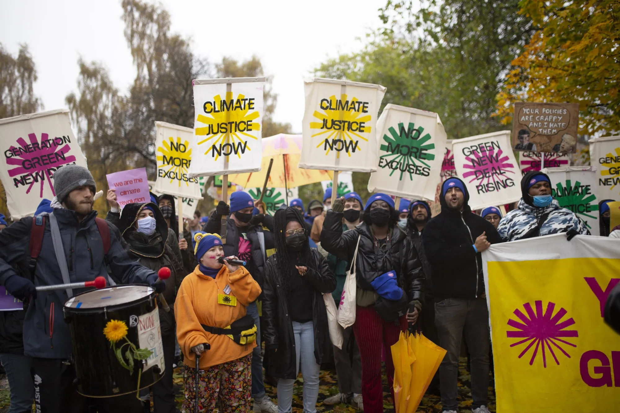 Demonstrators carry placards at COP26 climate talks in Glasgow, U.K. in 2021.&nbsp;