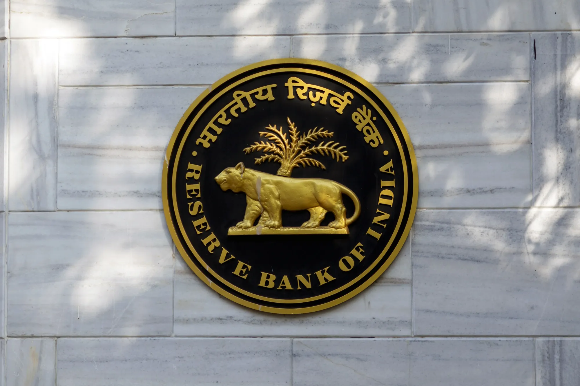 The Reserve Bank of India (RBI) logo is displayed outside the central bank in Mumbai, India, on Tuesday, March 3, 2020. RBI Governor Shaktikanta Das said he's ready to act to shield the economy from the coronavirus and reiterated there's room to cut interest rates if needed.