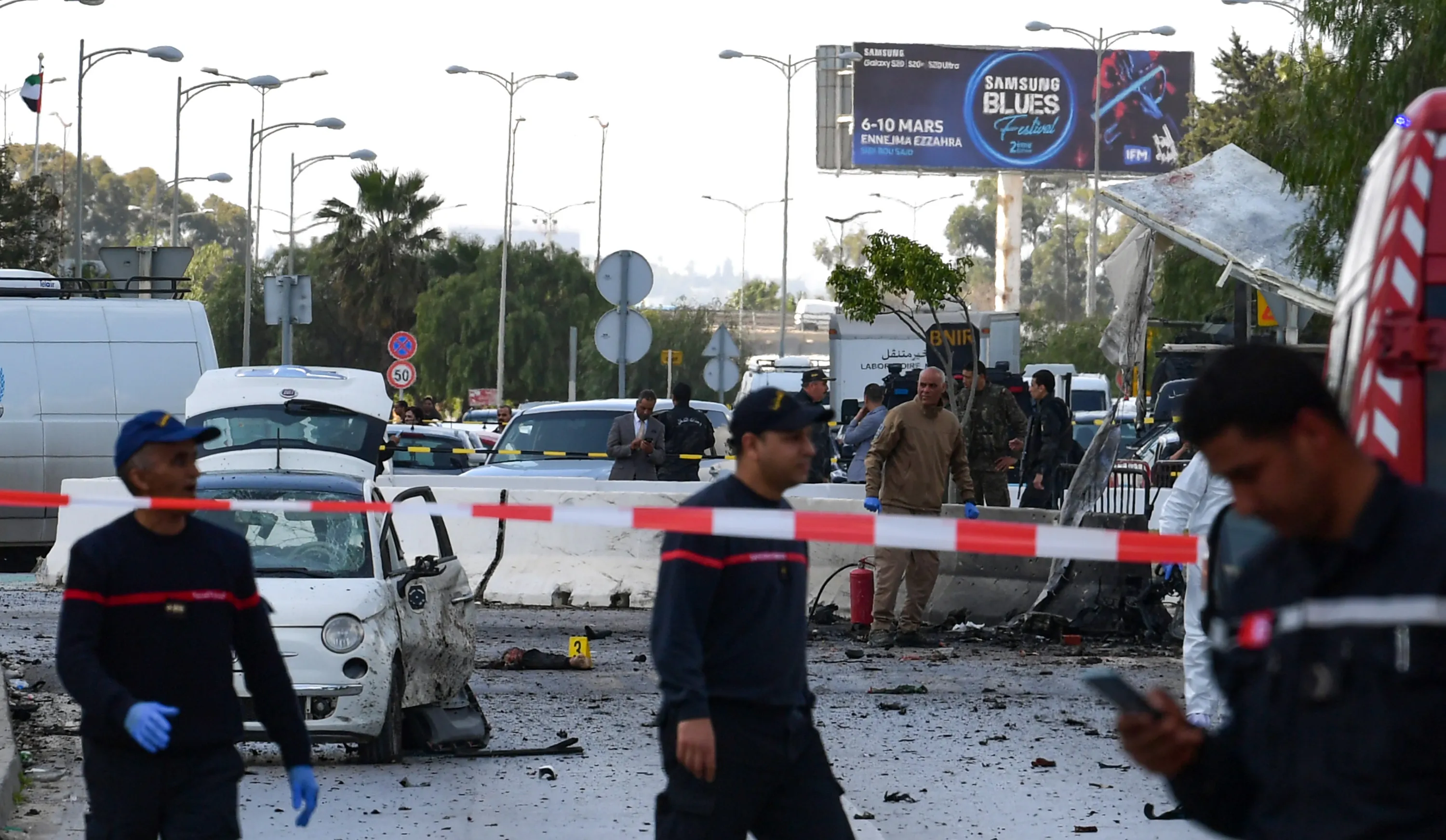 Police and firefighters gather at the scene of an explosion near the U.S. embassy in Tunis on March 6.